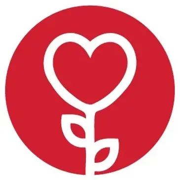 A red circle with a white heart and a plant in the middle.
